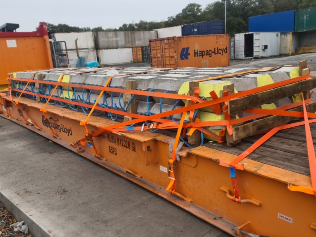 OOG concrete bridge section secured to 40ft flat rack for shipment to Dakar Senegal